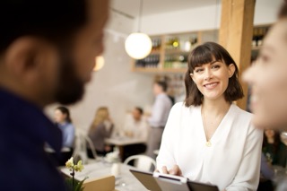 Host greeting guests with the Carbonara app